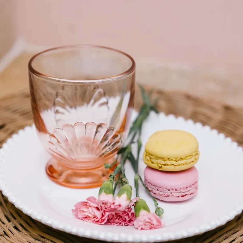 La Rochere Belle-ile tumbler in Pink on plate with macarons